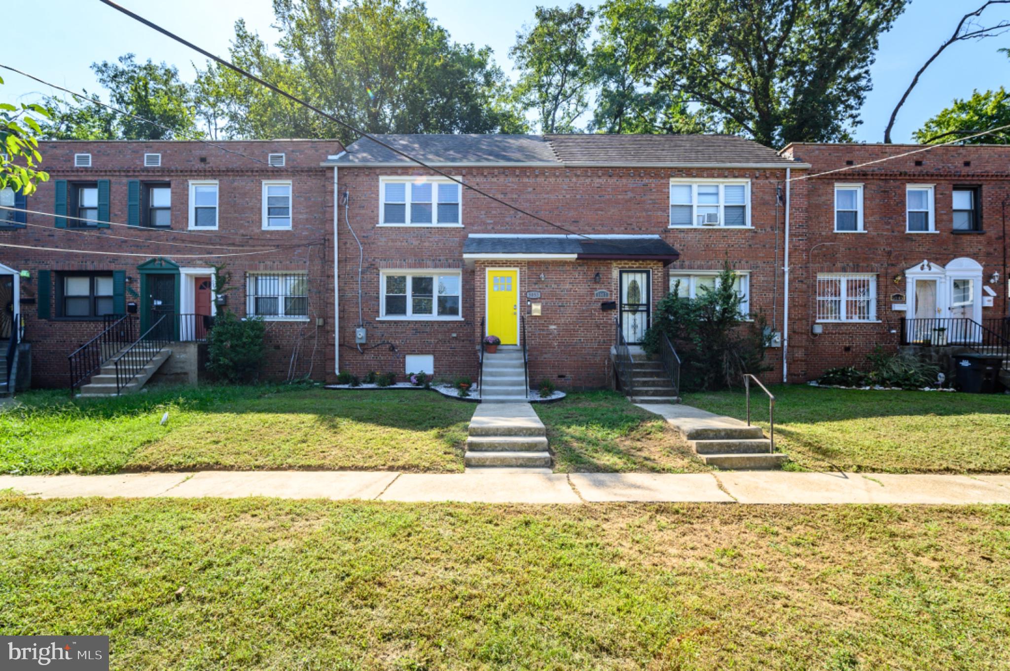 5053 Sheriff Road Northeast Washington, DC 20019 - Photo 30 of 32 Charming brick row home with vibrant door.