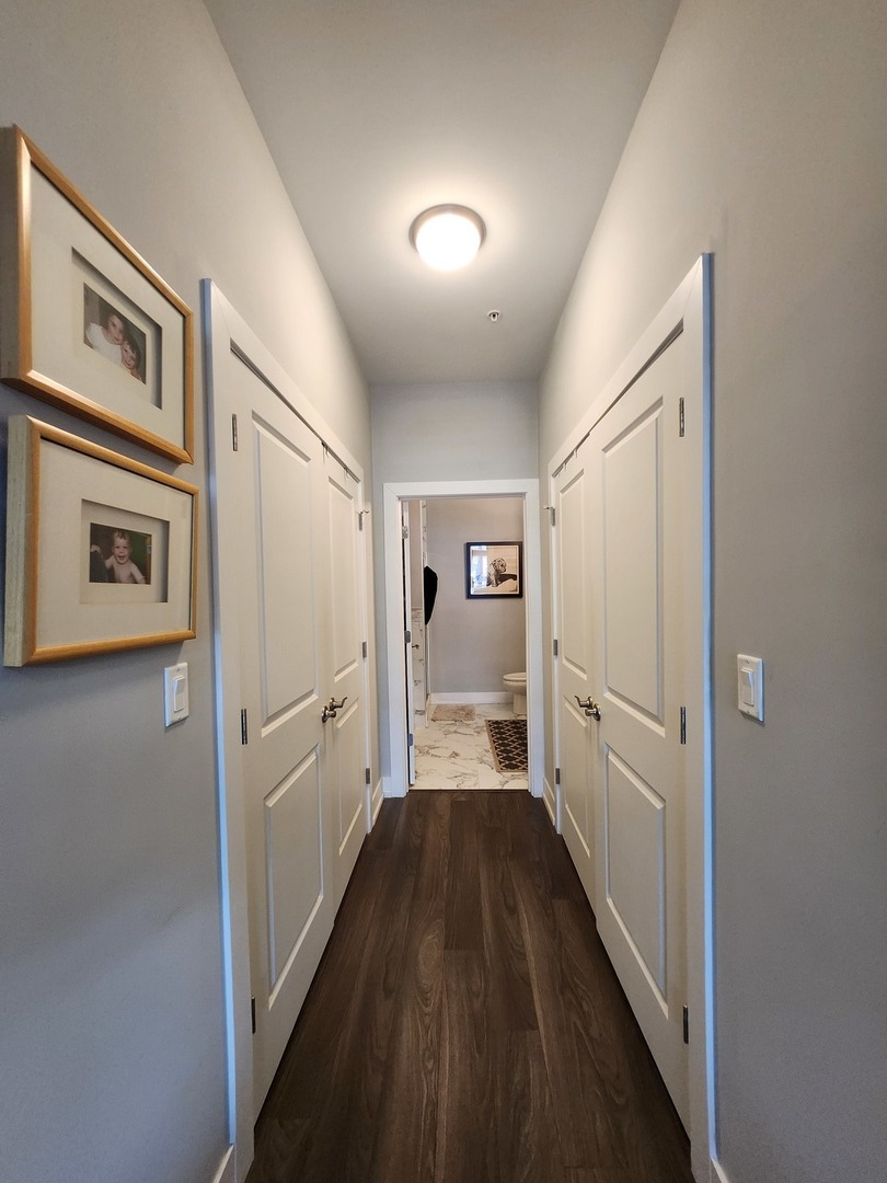 1202 Waukegan Road, Unit 209 Glenview, IL 60025 - Photo 11 of 22 a view of a hallway with a refrigerator