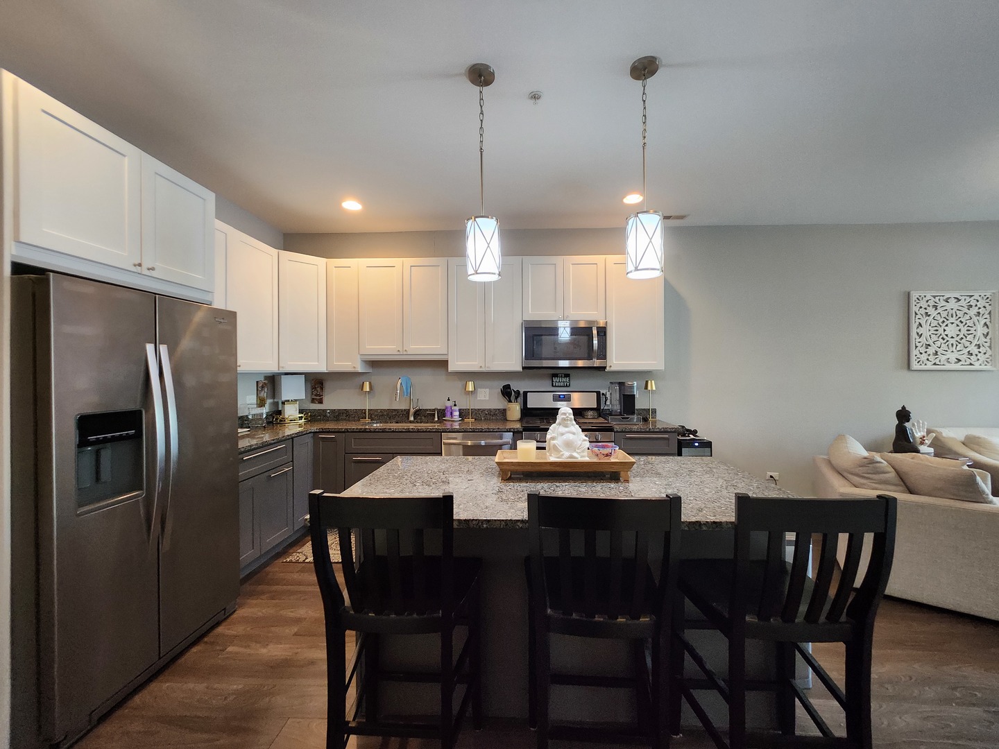 1202 Waukegan Road, Unit 209 Glenview, IL 60025 - Photo 2 of 22 a kitchen with a dining table chairs refrigerator and microwave