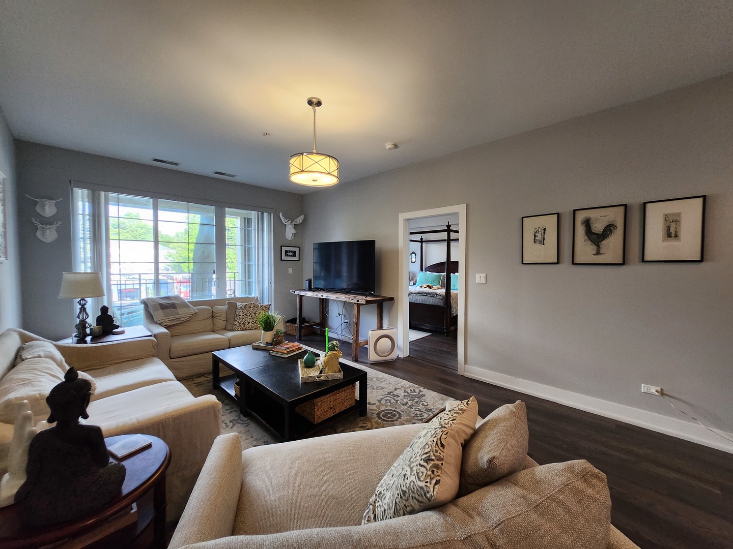 1202 Waukegan Road, Unit 209 Glenview, IL 60025 - Photo 7 of 22 a living room with furniture and a flat screen tv