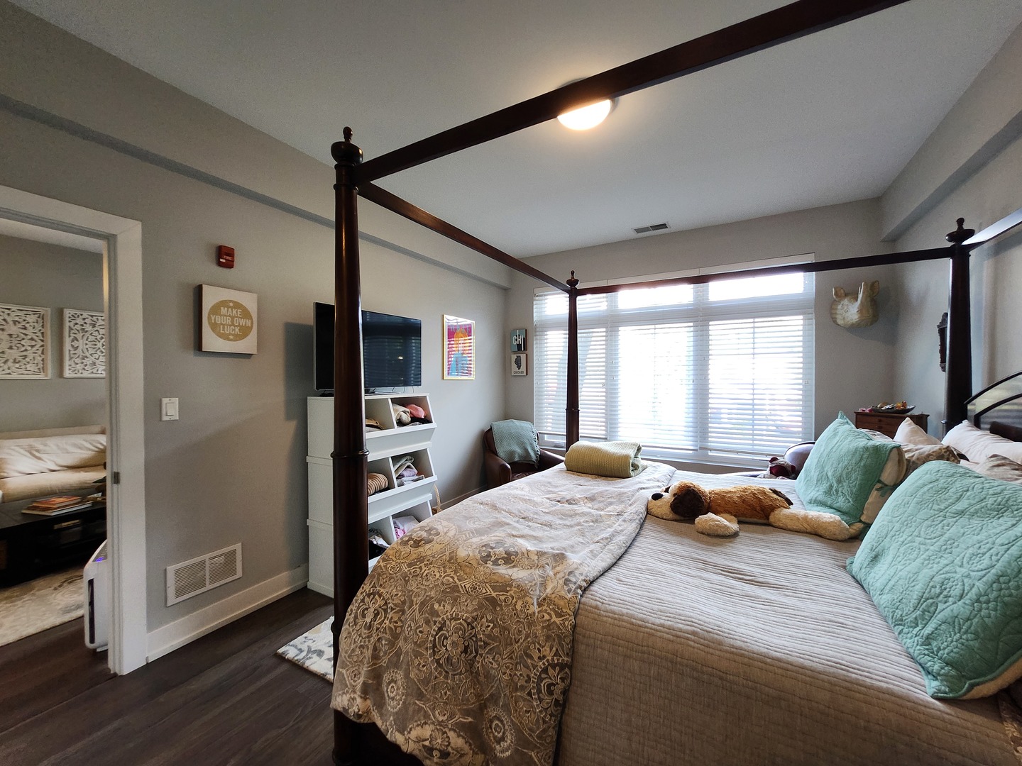 1202 Waukegan Road, Unit 209 Glenview, IL 60025 - Photo 9 of 22 a bedroom with a bed window and wooden floor