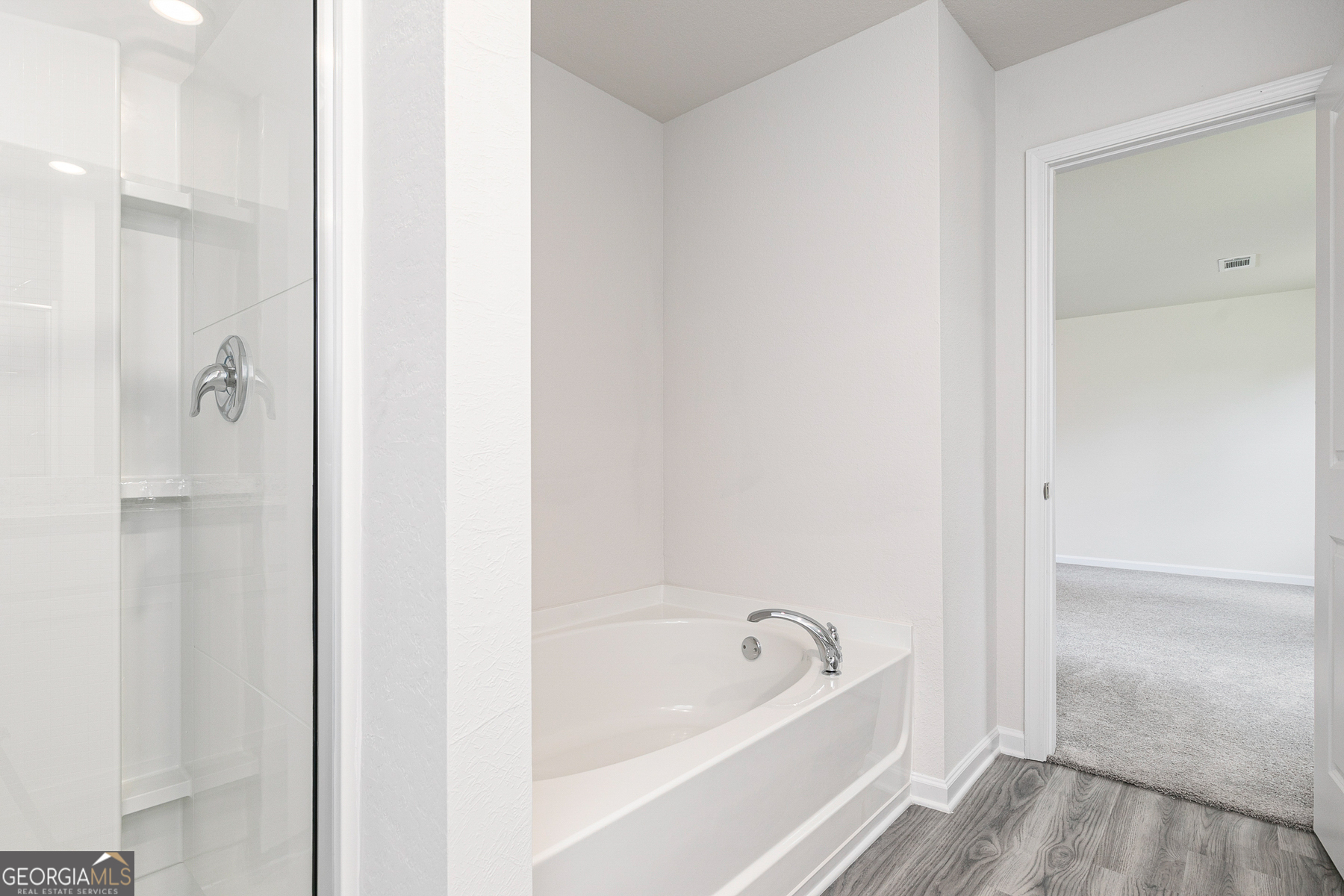 514 Plant Road Conyers, GA 30013 - Photo 11 of 18 a bathroom with a tub shower and sink