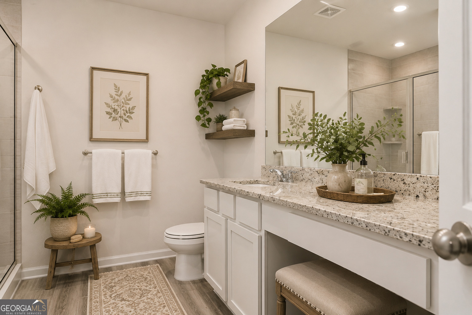 514 Plant Road Conyers, GA 30013 - Photo 17 of 18 a bathroom with a sink a toilet and a mirror