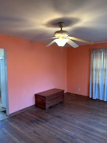 106 South Springer Street Carbondale, IL 62901 - Photo 12 of 20 a view of a room with wooden floor and chandelier fan