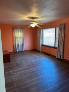 106 South Springer Street Carbondale, IL 62901 - Photo 13 of 20 an empty room with wooden floor and windows
