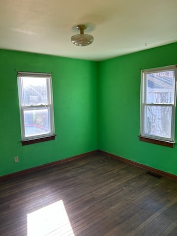 106 South Springer Street Carbondale, IL 62901 - Photo 15 of 20 a view of a room with a wooden floor and a window