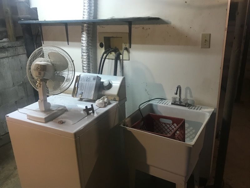 106 South Springer Street Carbondale, IL 62901 - Photo 19 of 20 a bathroom with a sink and a mirror