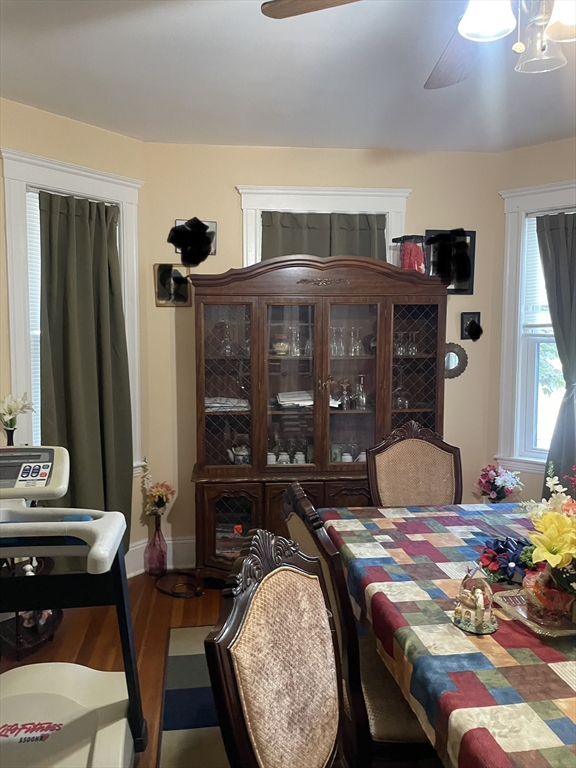 53 Mt Ida Road, Unit 1 Boston, MA 02122 - Photo 4 of 10 a bedroom with a bed and wooden floor