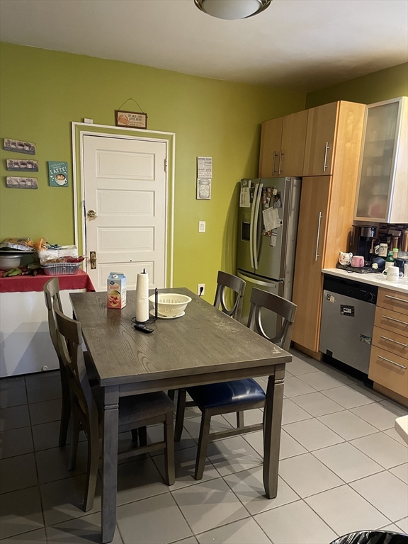 53 Mt Ida Road, Unit 1 Boston, MA 02122 - Photo 8 of 10 a view of a dining room with furniture