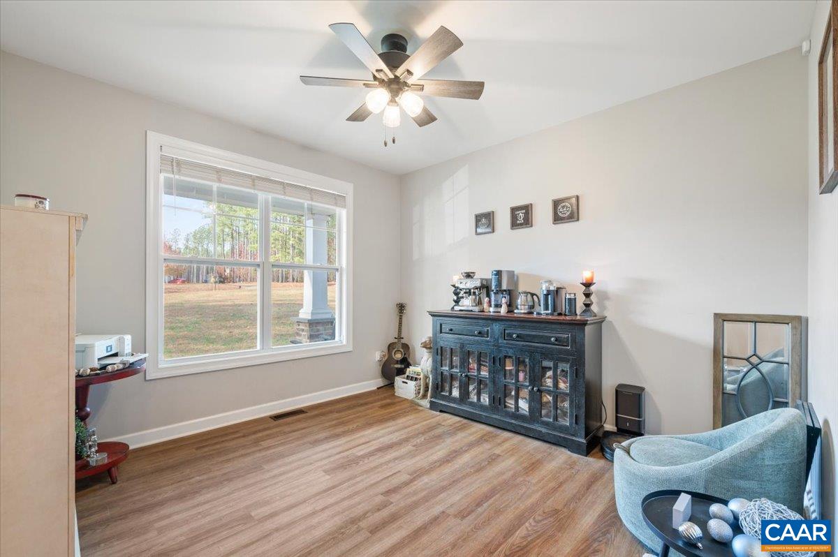 481 Country Creek Way Palmyra, VA 22963 - Photo 11 of 66 a living room with furniture and a wooden floor