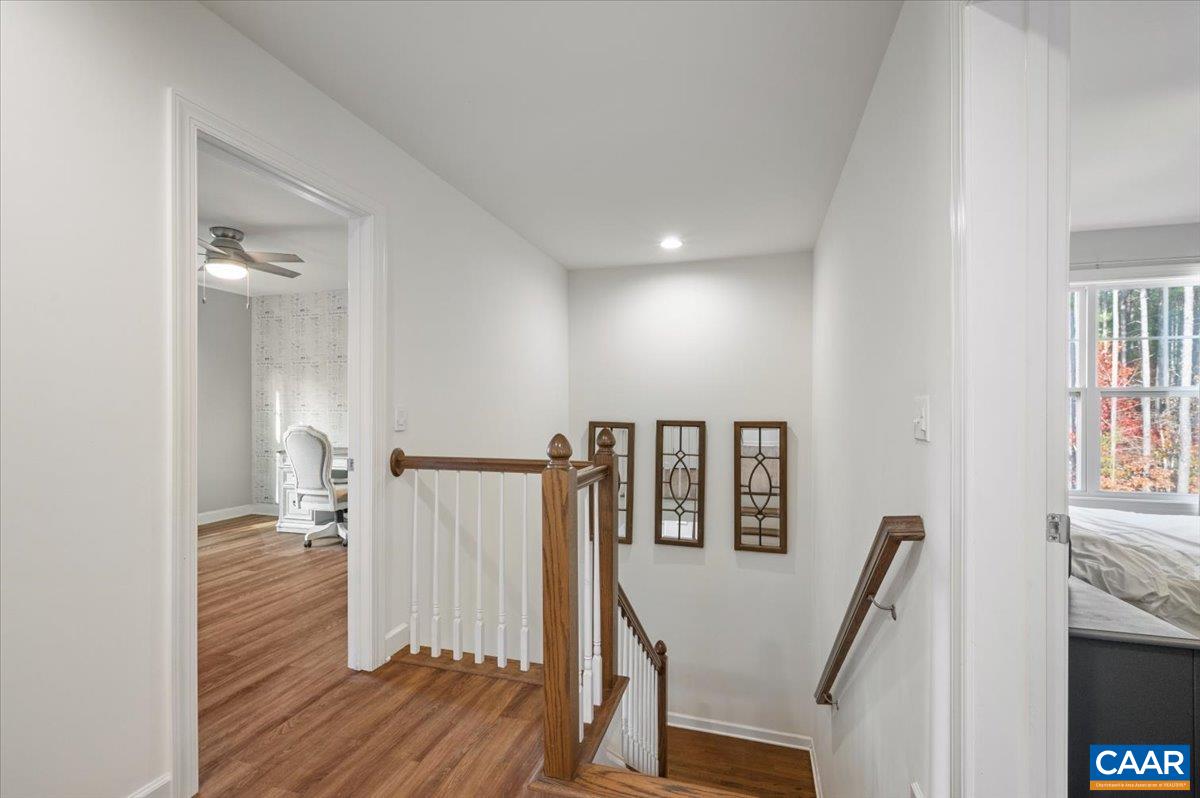 481 Country Creek Way Palmyra, VA 22963 - Photo 12 of 66 a view of a hallway with furniture and wooden floor