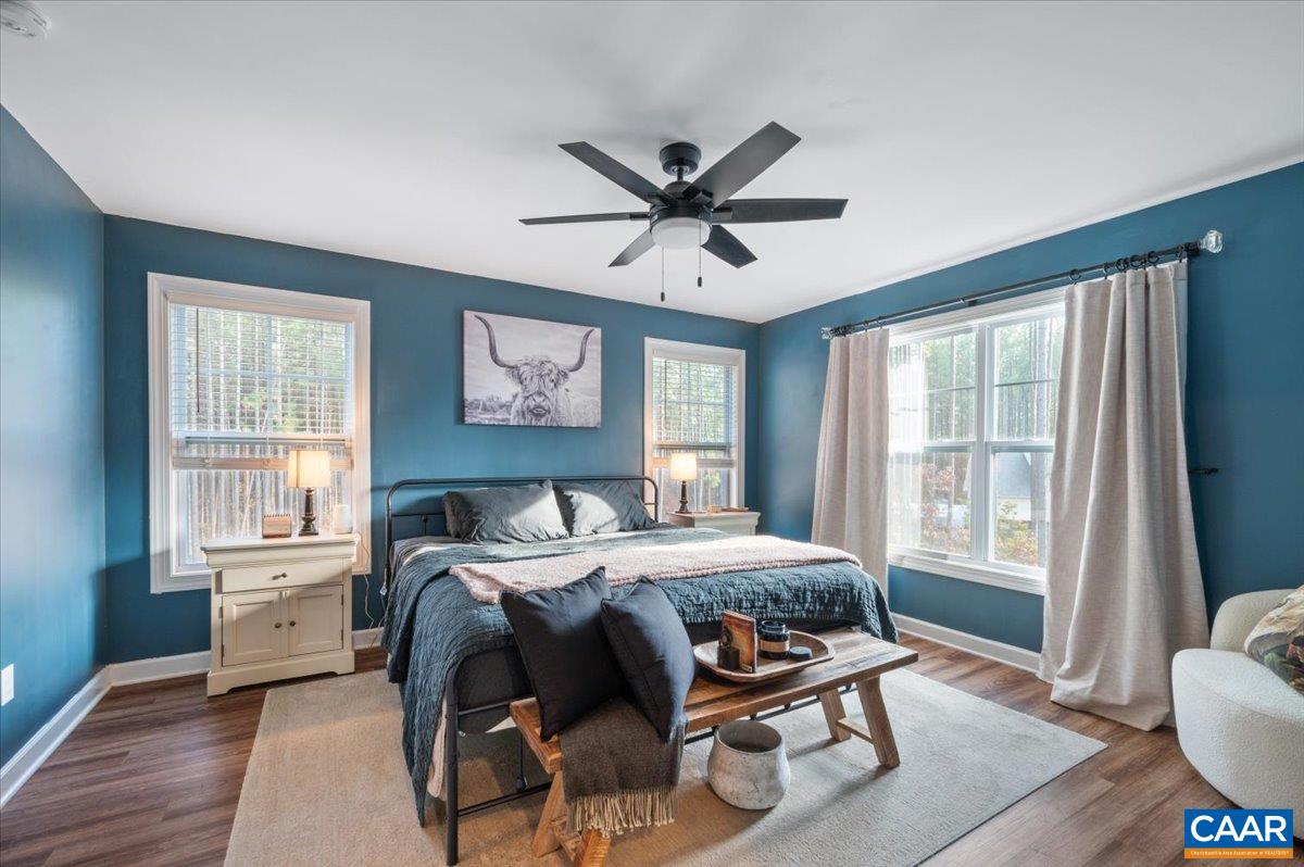 481 Country Creek Way Palmyra, VA 22963 - Photo 15 of 66 a bedroom with a bed and wooden floor