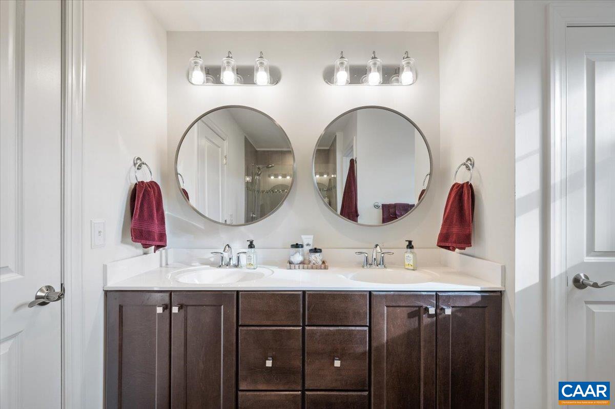 481 Country Creek Way Palmyra, VA 22963 - Photo 20 of 66 a bathroom with a double vanity sink and a mirror