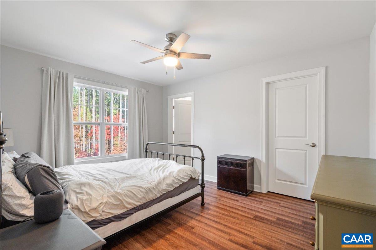 481 Country Creek Way Palmyra, VA 22963 - Photo 21 of 66 a bedroom with a bed and wooden floor