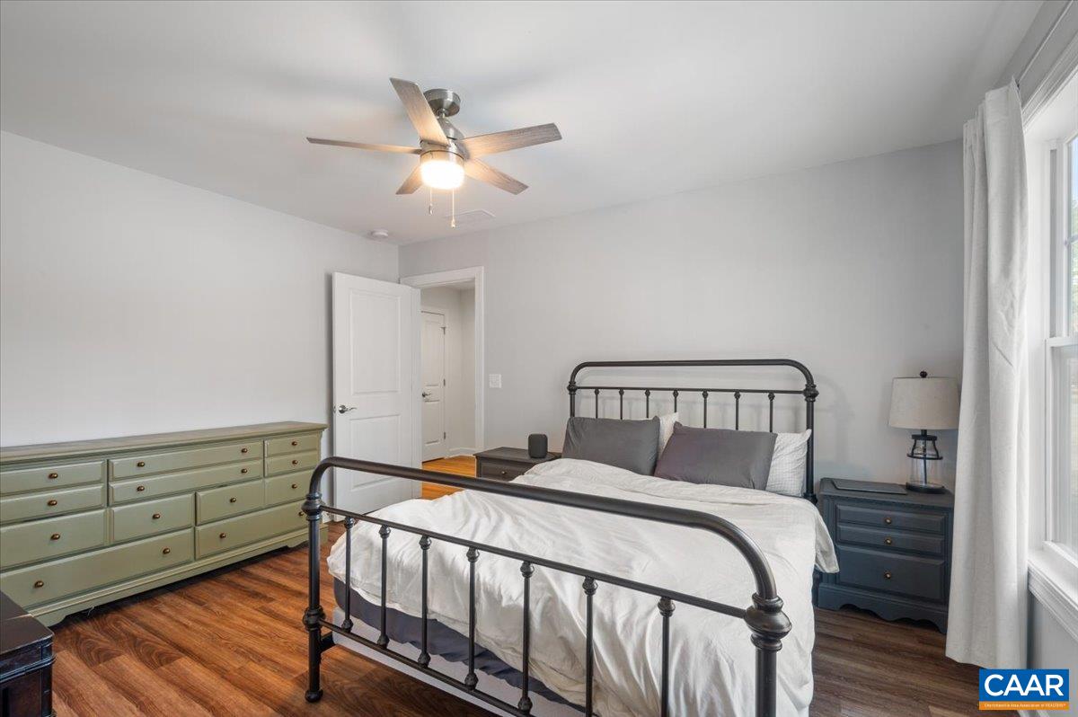 481 Country Creek Way Palmyra, VA 22963 - Photo 22 of 66 a bedroom with a bed and wooden floor