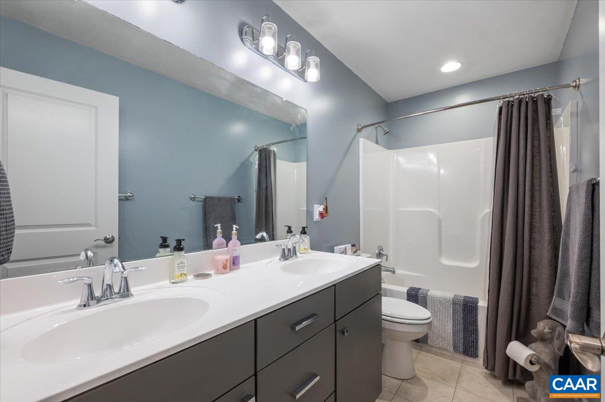 481 Country Creek Way Palmyra, VA 22963 - Photo 24 of 66 a bathroom with a double vanity sink mirror and toilet