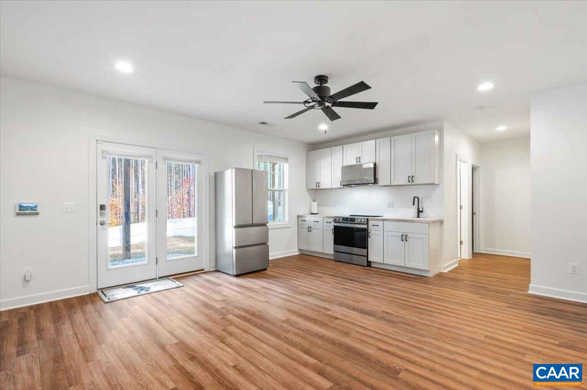 481 Country Creek Way Palmyra, VA 22963 - Photo 29 of 66 a view of kitchen with stainless steel appliances refrigerator stove microwave and cabinets