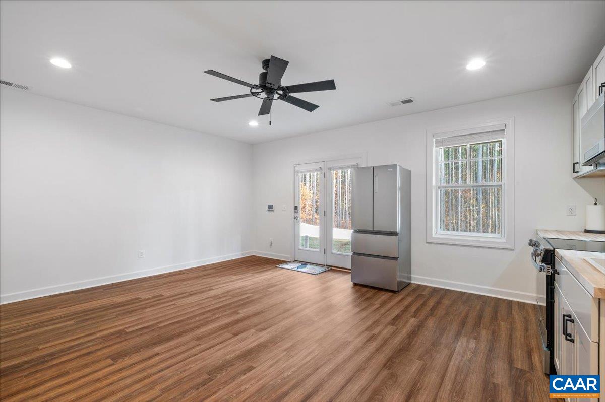 481 Country Creek Way Palmyra, VA 22963 - Photo 30 of 66 a view of empty room with wooden floor and fan