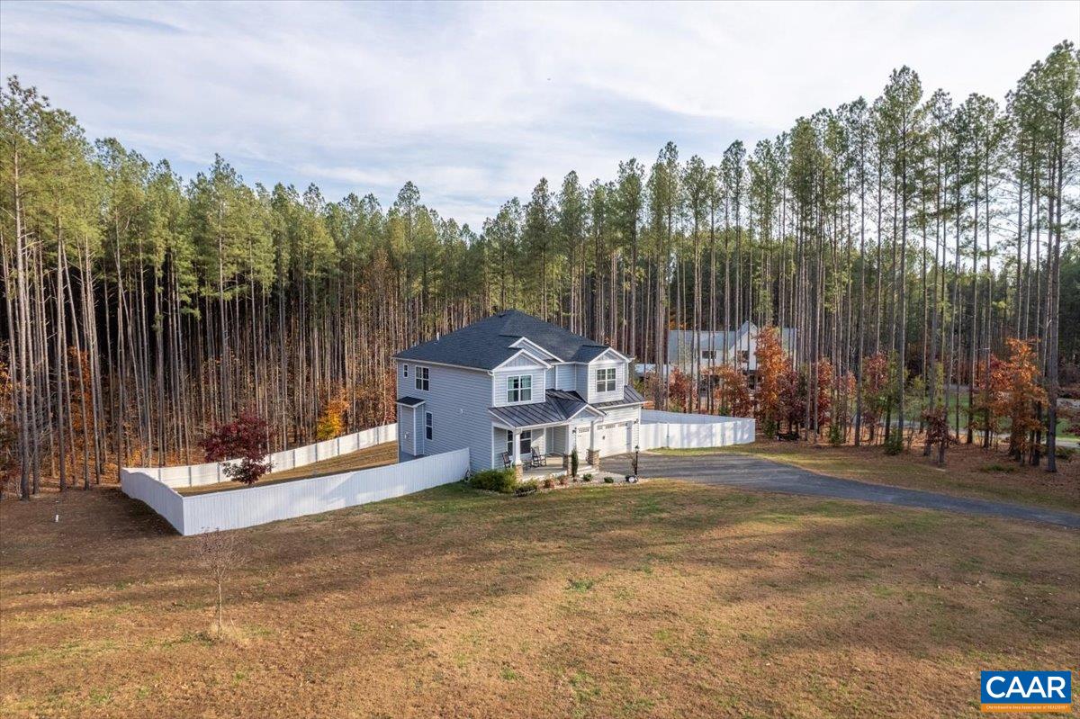 481 Country Creek Way Palmyra, VA 22963 - Photo 44 of 66 a wooden bench sitting in front of a building