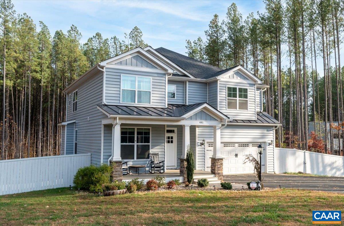 481 Country Creek Way Palmyra, VA 22963 - Photo 47 of 66 a front view of a house with a yard and balcony