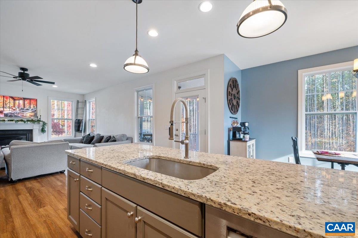 481 Country Creek Way Palmyra, VA 22963 - Photo 7 of 66 a kitchen with stainless steel appliances granite countertop a sink dishwasher and a stove with wooden floor