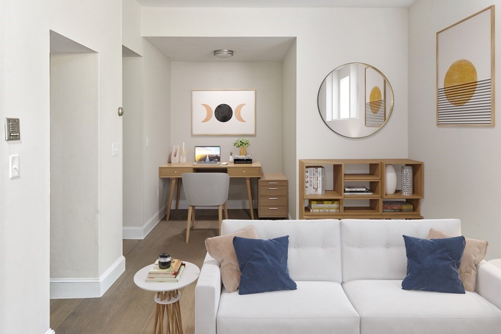 1000 Centre Street, Unit 3 Boston, MA 02130 - Photo 6 of 14 a living room with a couch and a chandelier