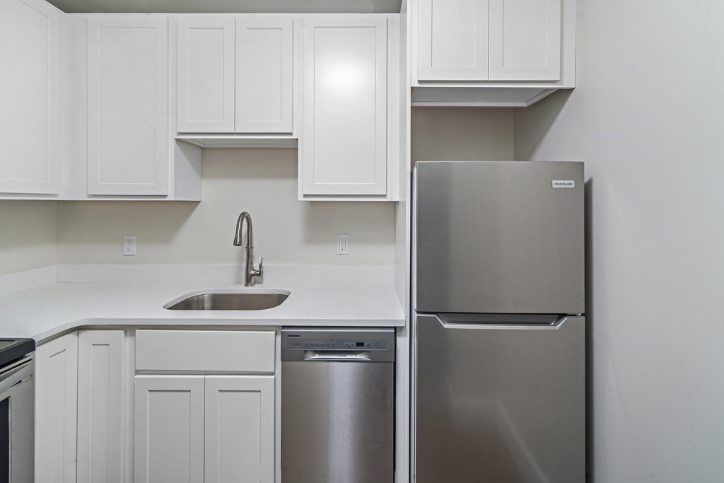 1000 Centre Street, Unit 3 Boston, MA 02130 - Photo 7 of 14 a kitchen with a refrigerator and cabinets