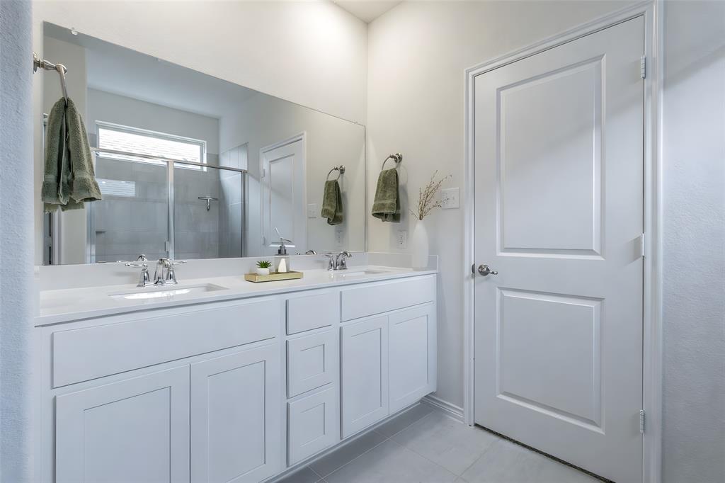 705 Jessica Lynn Lane Anna, TX 75409 - Photo 13 of 26 a bathroom with 2 sink and a mirror