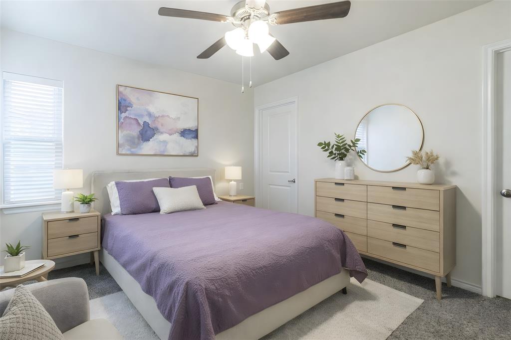 705 Jessica Lynn Lane Anna, TX 75409 - Photo 14 of 26 a bedroom with a bed and a chandelier