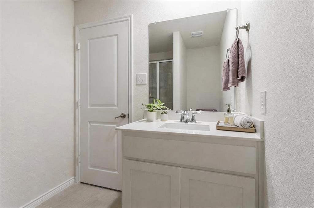 705 Jessica Lynn Lane Anna, TX 75409 - Photo 16 of 26 a bathroom with a sink and a mirror