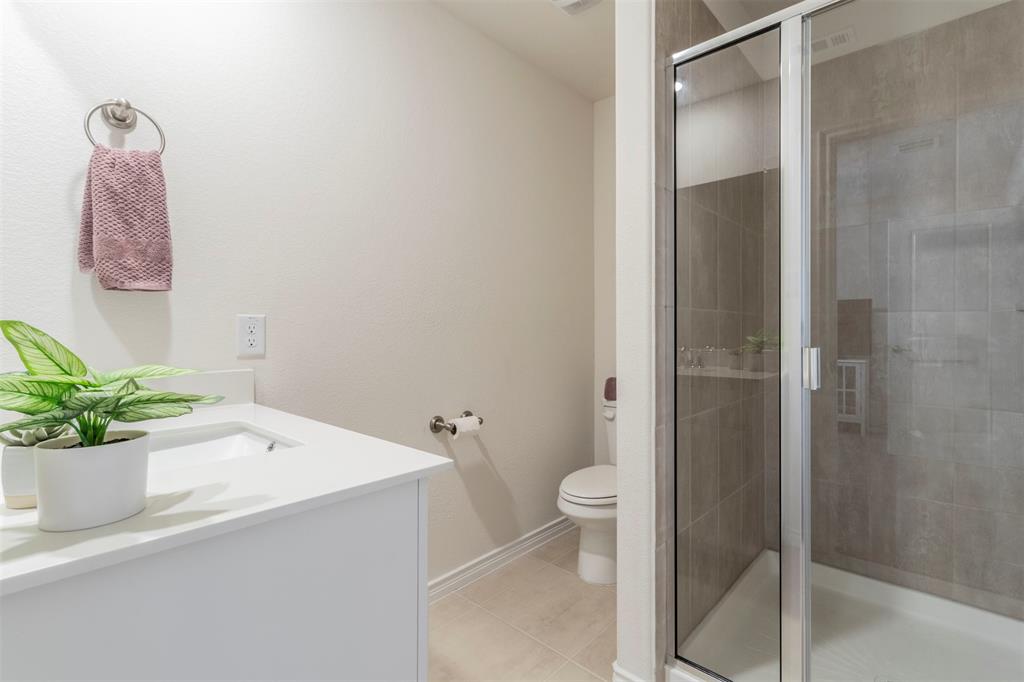 705 Jessica Lynn Lane Anna, TX 75409 - Photo 17 of 26 a bathroom with a sink a toilet and shower