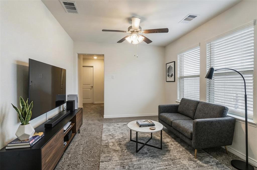 705 Jessica Lynn Lane Anna, TX 75409 - Photo 18 of 26 a living room with furniture and a flat screen tv
