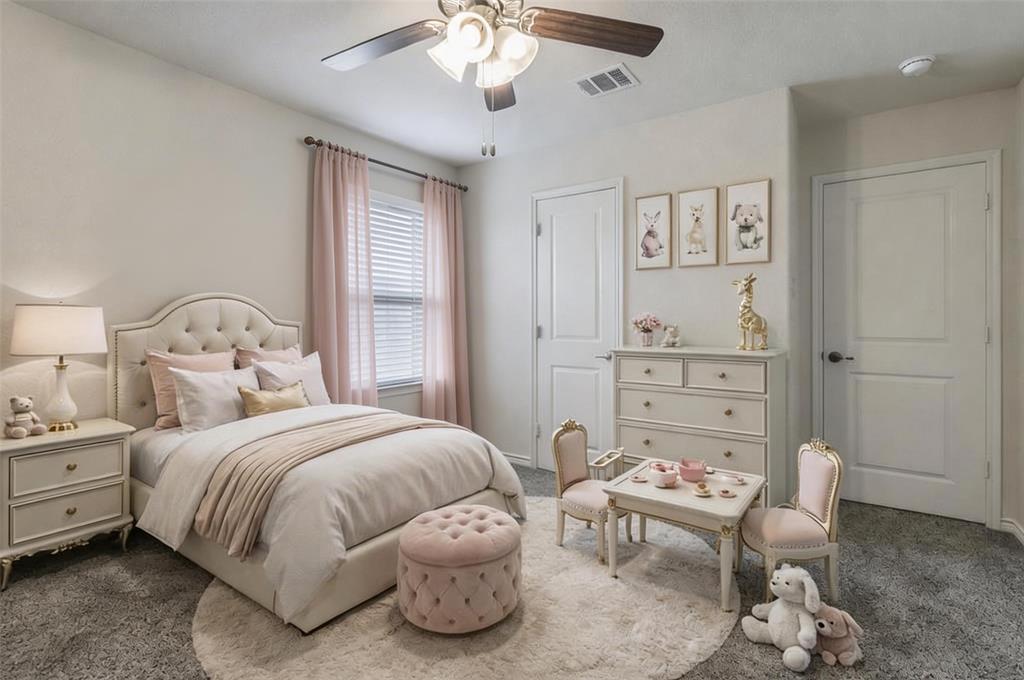 705 Jessica Lynn Lane Anna, TX 75409 - Photo 19 of 26 a bedroom with a bed and a chandelier