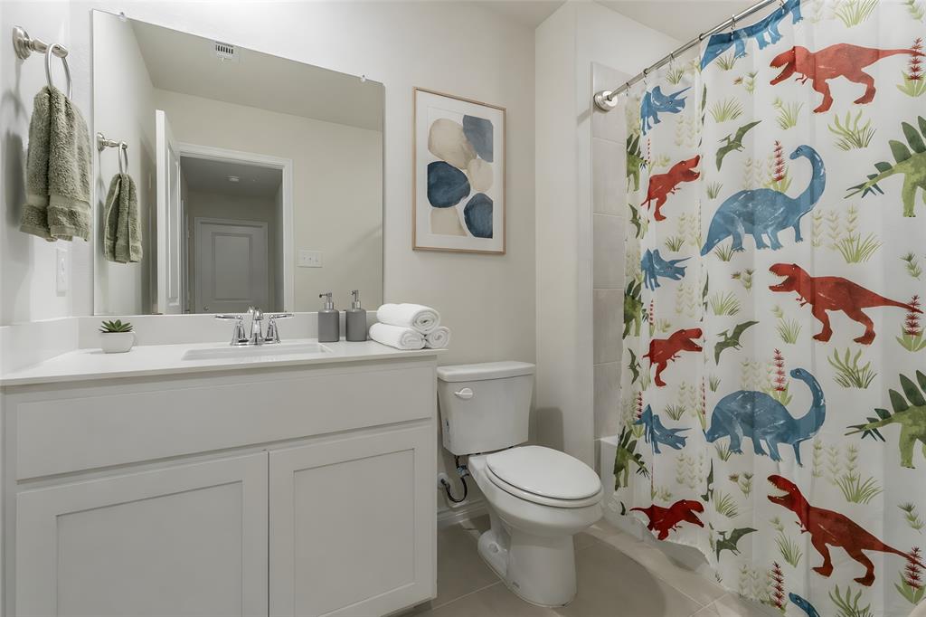 705 Jessica Lynn Lane Anna, TX 75409 - Photo 20 of 26 a bathroom with a sink and a mirror