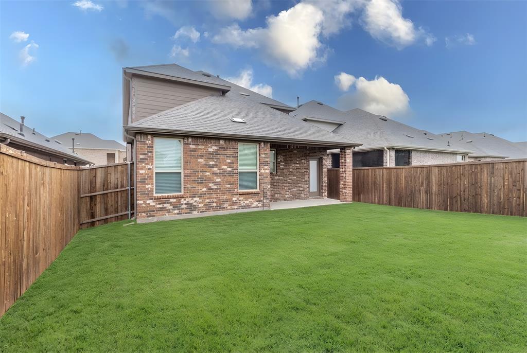 705 Jessica Lynn Lane Anna, TX 75409 - Photo 23 of 26 a backyard of a house with lots of green space