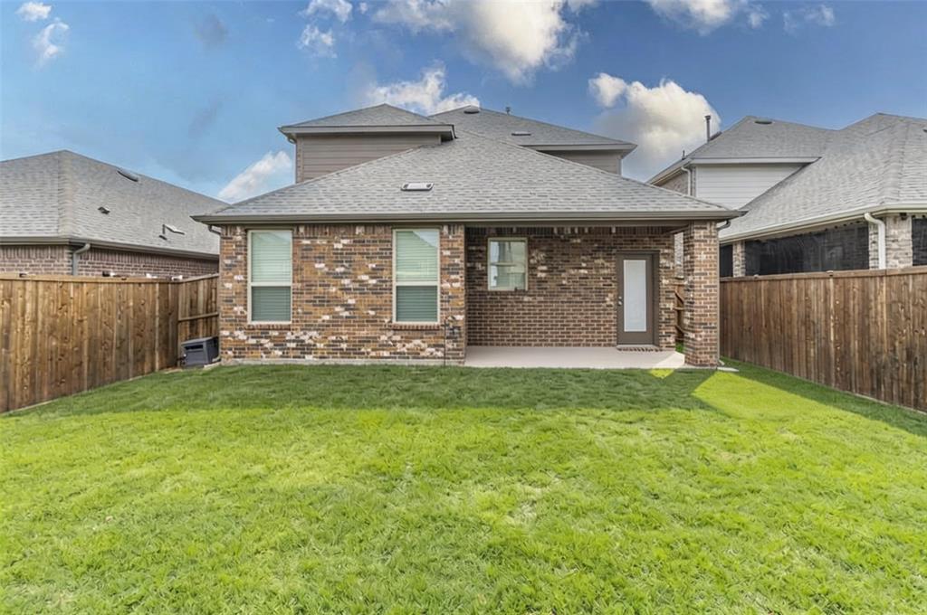 705 Jessica Lynn Lane Anna, TX 75409 - Photo 24 of 26 a front view of a house with garden