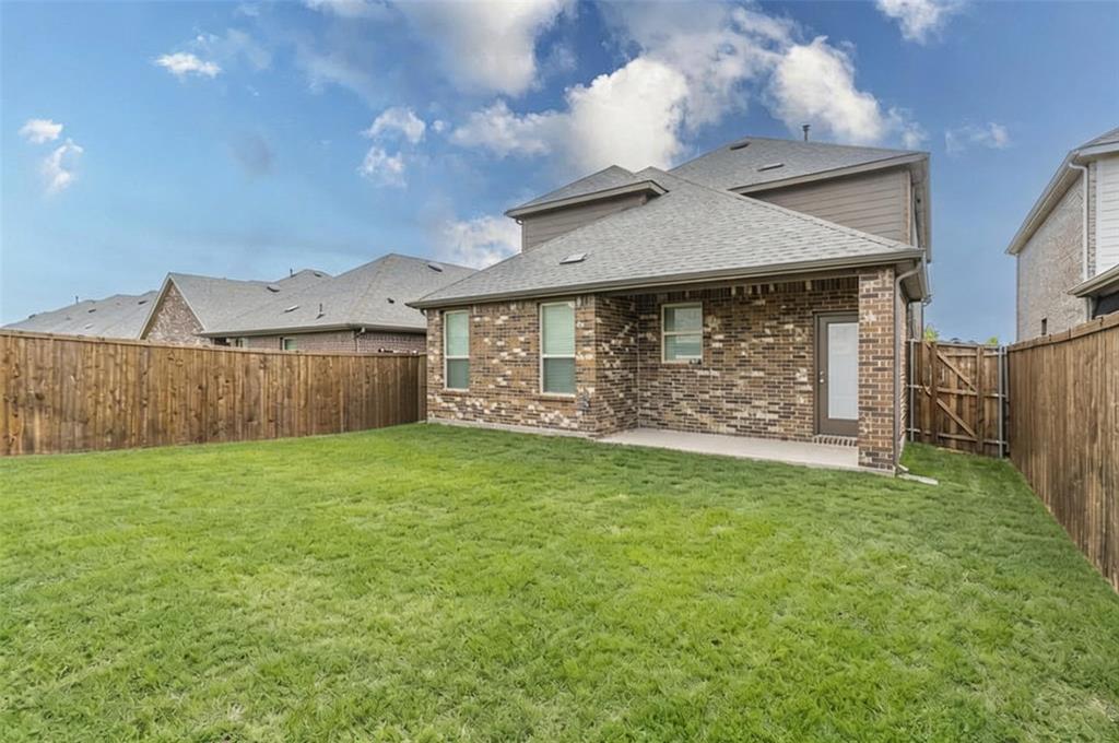 705 Jessica Lynn Lane Anna, TX 75409 - Photo 25 of 26 a front view of a house with a yard and garage