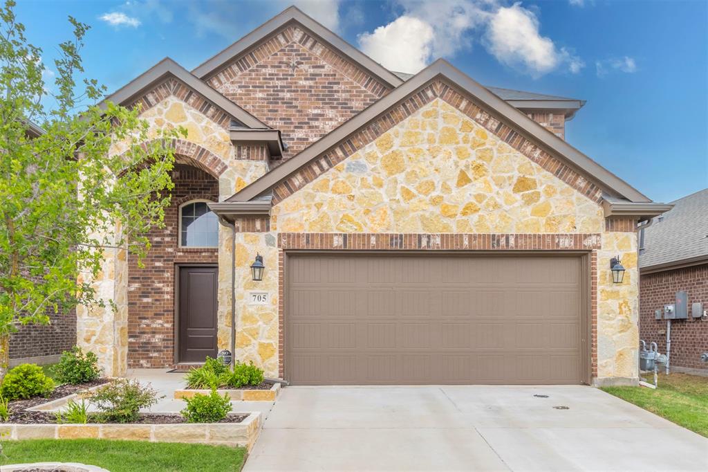 705 Jessica Lynn Lane Anna, TX 75409 - Photo 3 of 26 a front view of a house with garden
