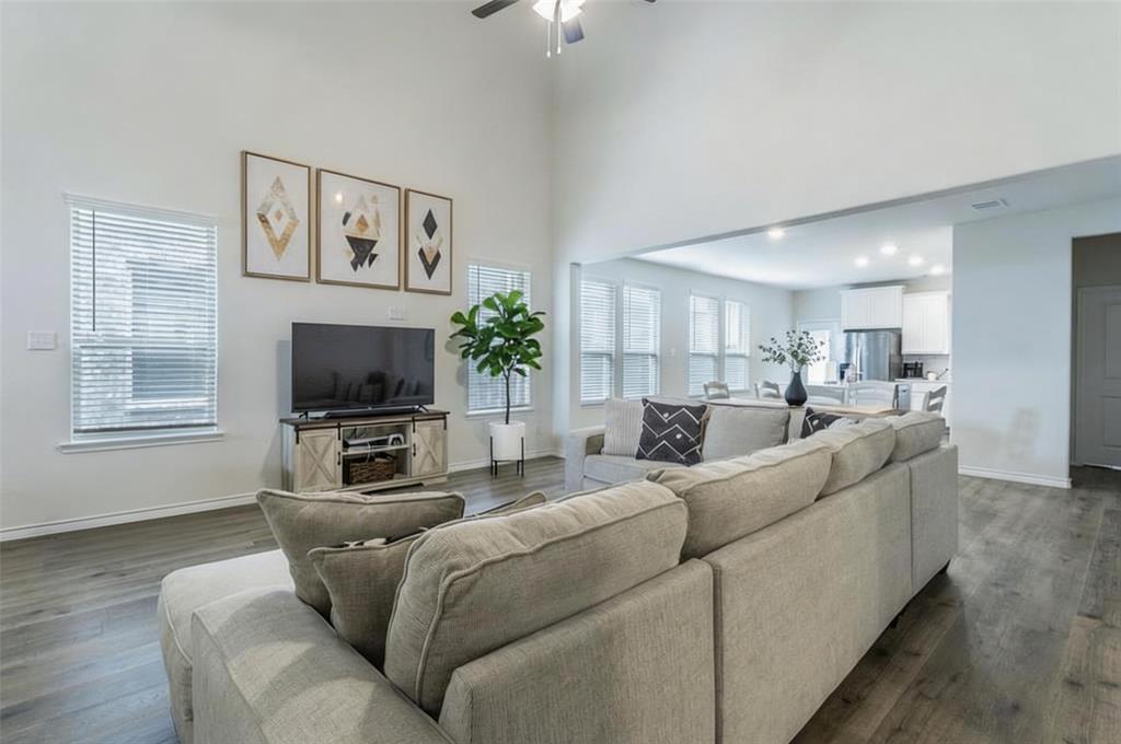 705 Jessica Lynn Lane Anna, TX 75409 - Photo 5 of 26 a living room with furniture and a flat screen tv