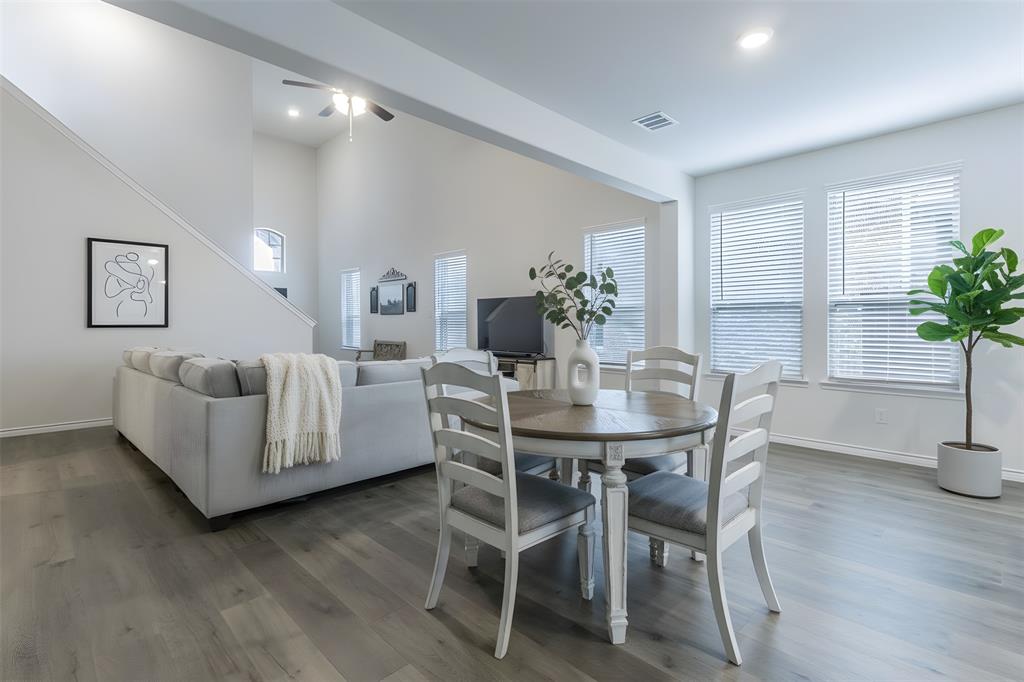 705 Jessica Lynn Lane Anna, TX 75409 - Photo 6 of 26 a view of a dining room with furniture and wooden floor