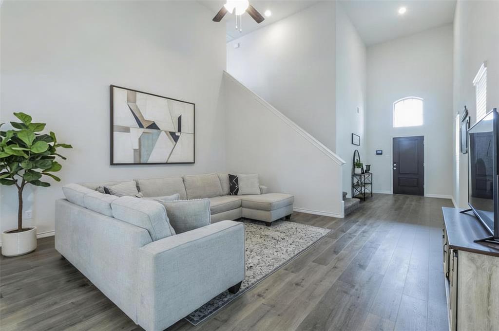 705 Jessica Lynn Lane Anna, TX 75409 - Photo 7 of 26 a living room with furniture and a potted plant