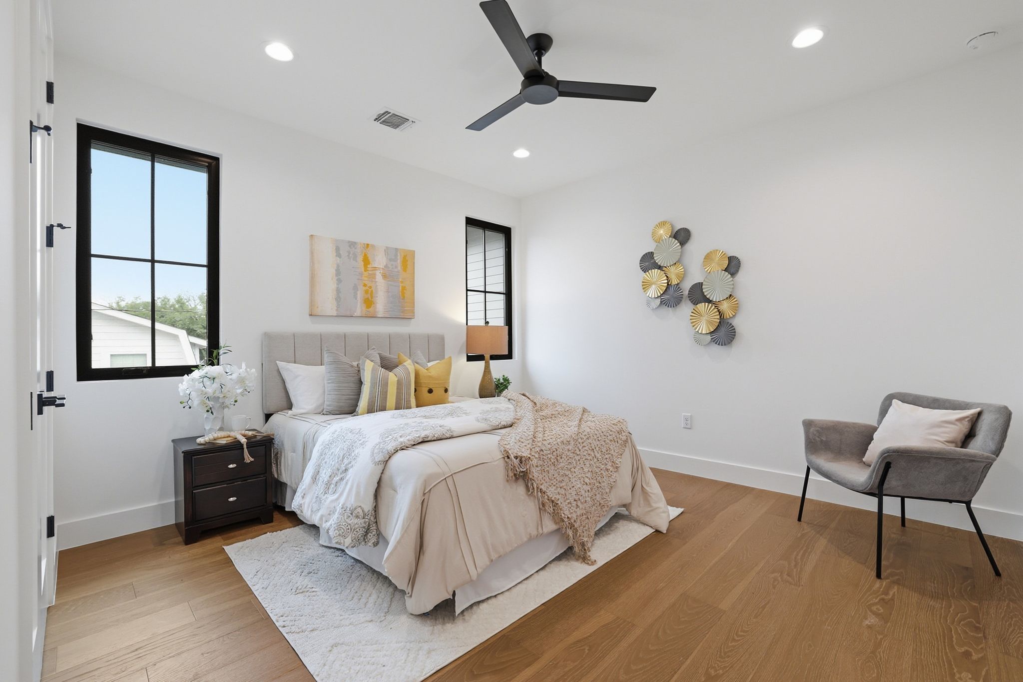 6611 Lexington Road Austin, TX 78757 - Photo 30 of 37 Bedroom featuring warm wood-finish flooring, recessed lighting, and a modern ceiling fan