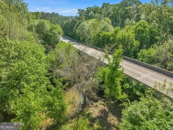 a view of a forest from a balcony