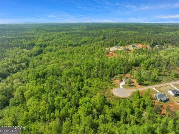 a view of a lake with a yard