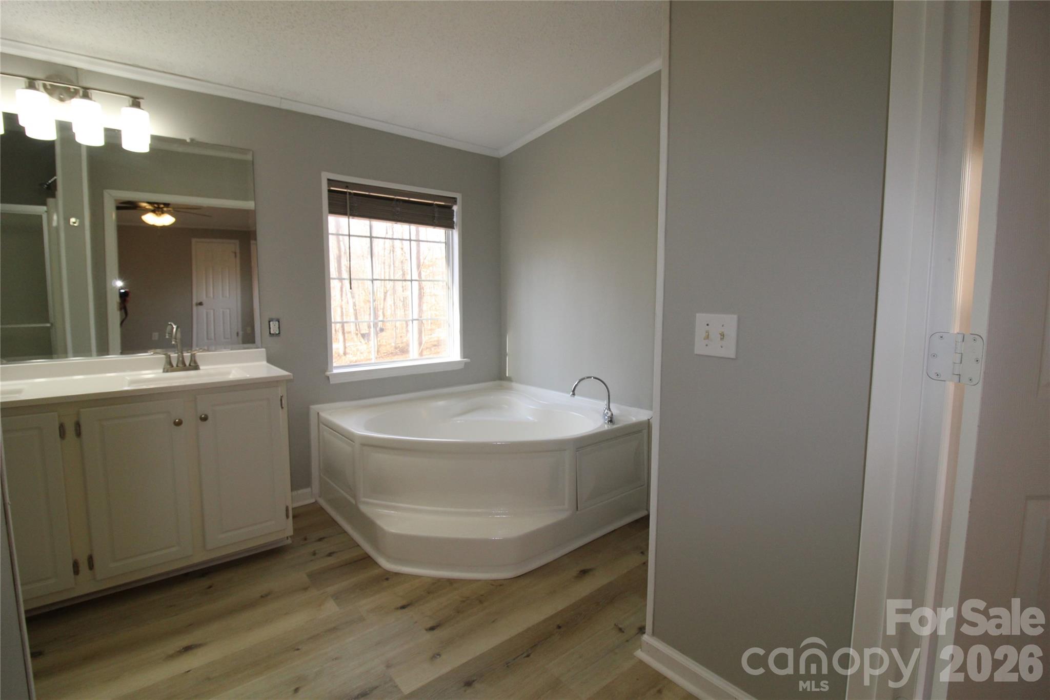 410 Johnstone Road Cleveland, NC 27013 - Photo 12 of 43 a bathroom with a tub sink and mirror