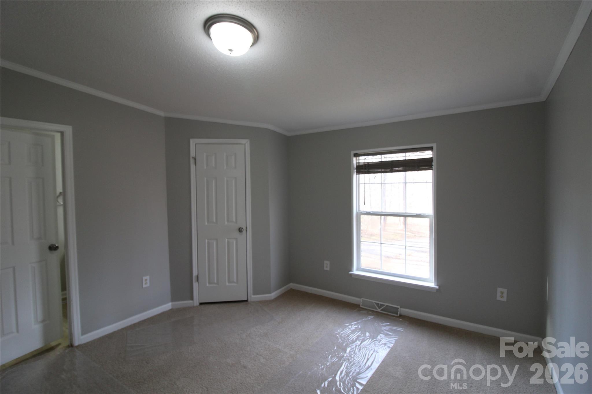 410 Johnstone Road Cleveland, NC 27013 - Photo 16 of 43 an empty room with windows