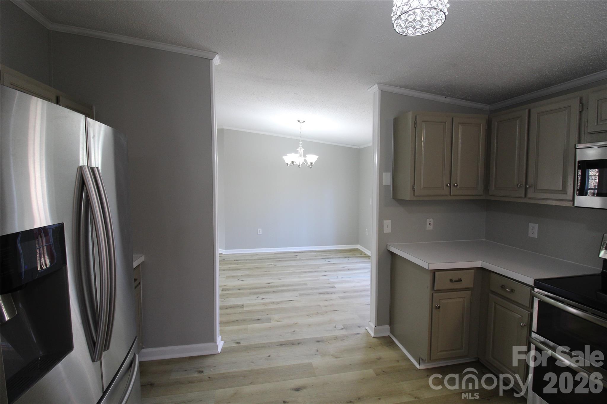 410 Johnstone Road Cleveland, NC 27013 - Photo 20 of 43 a kitchen with stainless steel appliances a refrigerator and a stove top oven