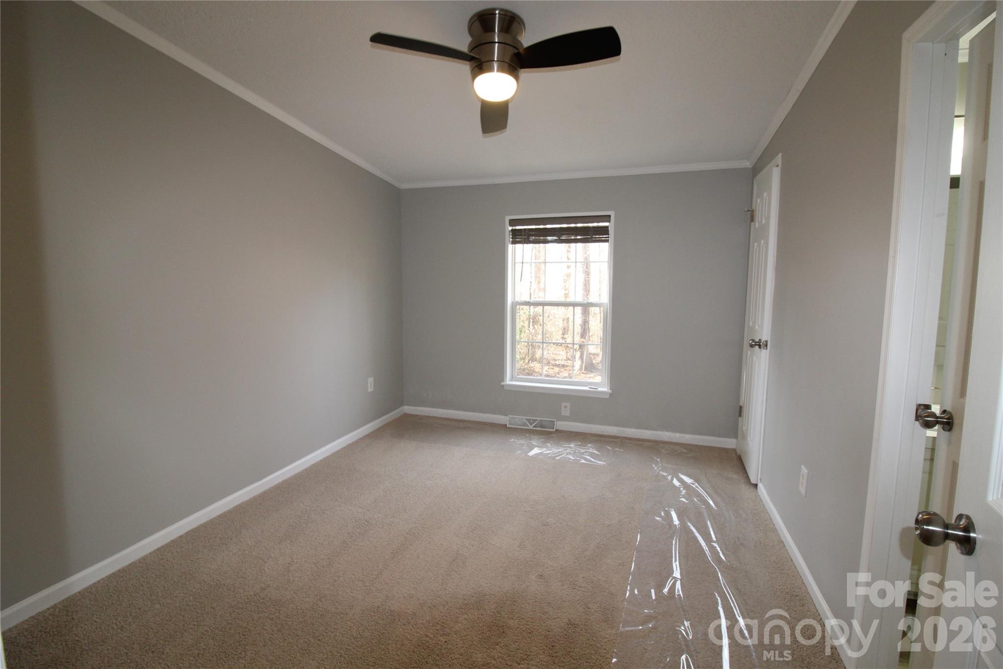 410 Johnstone Road Cleveland, NC 27013 - Photo 24 of 43 an empty room with windows and fan