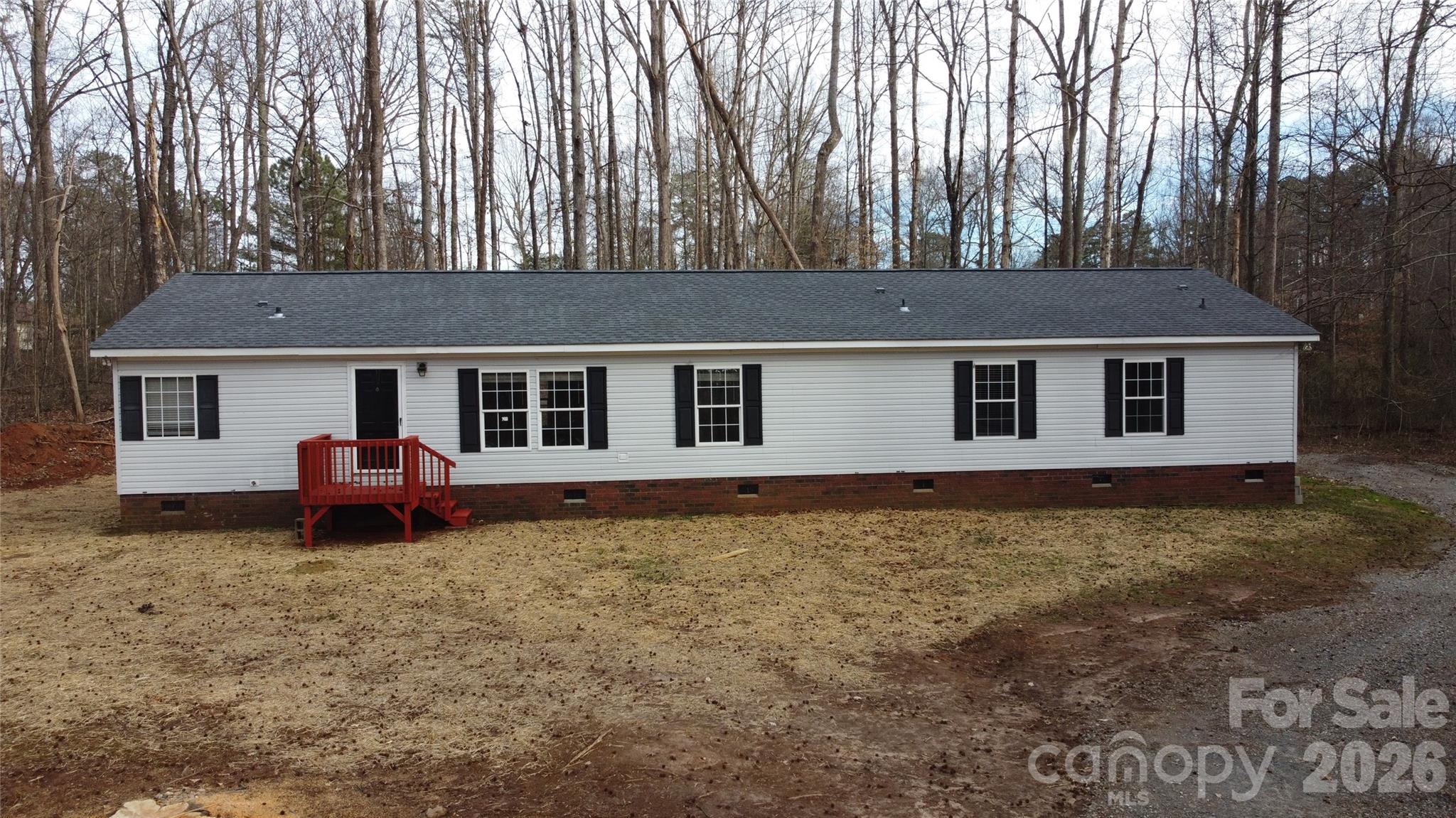 410 Johnstone Road Cleveland, NC 27013 - Photo 29 of 43 a house that has a tree in front of it