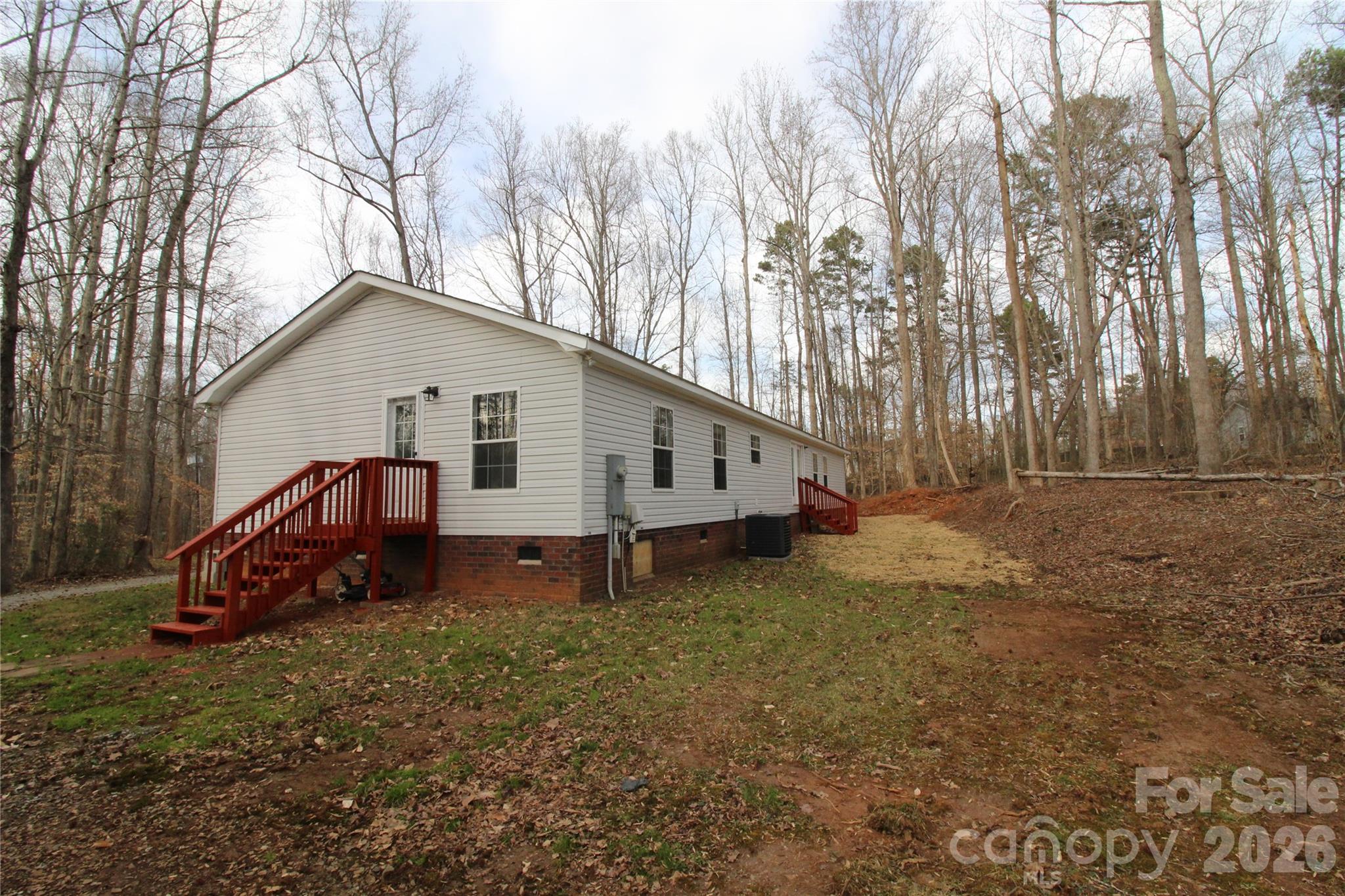 410 Johnstone Road Cleveland, NC 27013 - Photo 30 of 43 a house with trees in the background